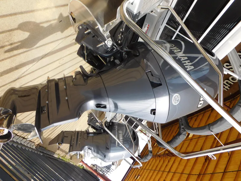 Slide: The Image of 2023 Bennington 22 SXL with Yamaha outboard motor, side view. - 7