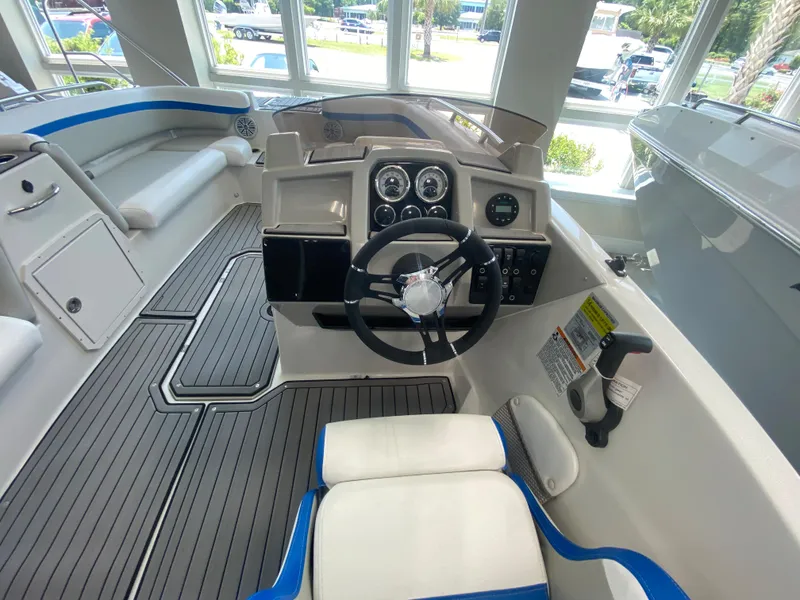 Slide: The Image of 2024 Starcraft SVX 211 boat interior with steering wheel and dashboard. - 12