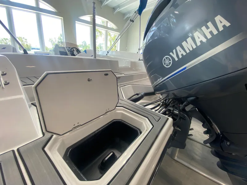 Slide: The Image of 2024 Starcraft SVX 211 boat with Yamaha outboard motor in showroom. - 3