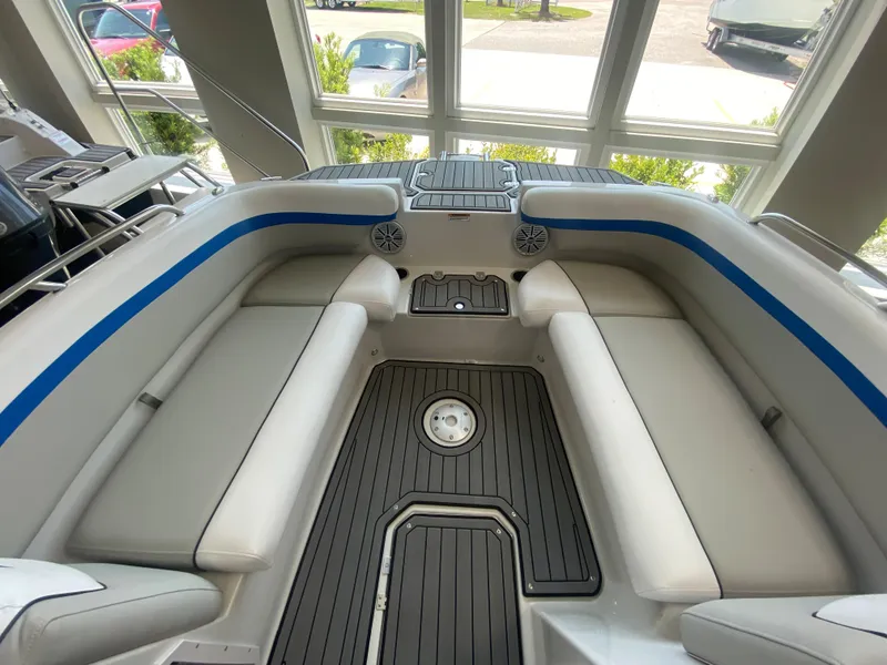 Slide: The Image of 2024 Starcraft SVX 211 boat interior with cushioned seating and modern design. - 9