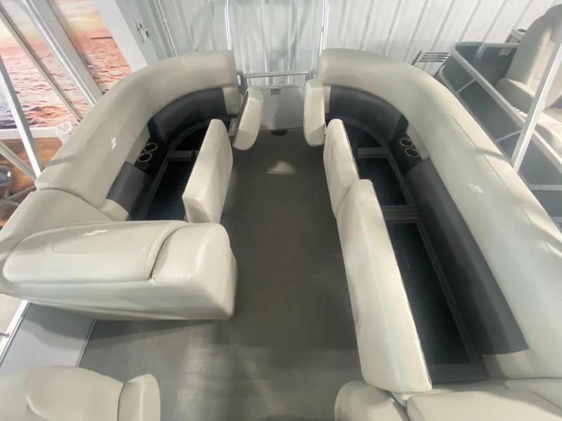 Slide: The Image of 2023 Starcraft LX22 R pontoon boat interior with spacious seating. - 12
