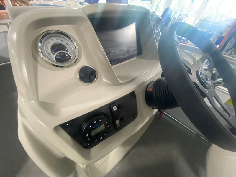 Slide: The Image of 2023 Starcraft LX22 R boat dashboard with steering wheel and control panel. - 9