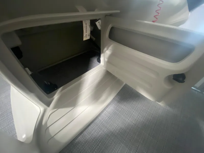 Slide: The Image of Open storage compartment in 2023 Starcraft LX22 R boat. - 14