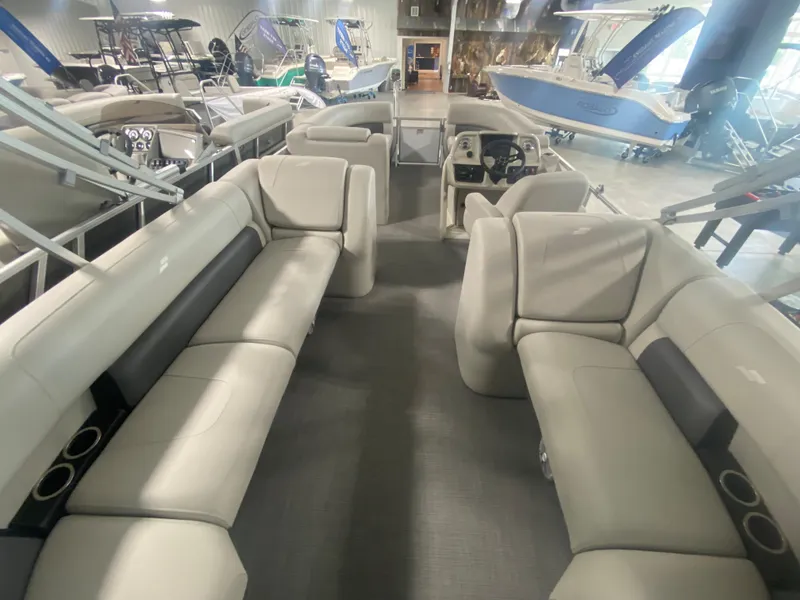 Slide: The Image of 2023 Starcraft LX22 R pontoon boat interior with spacious seating and modern design. - 4