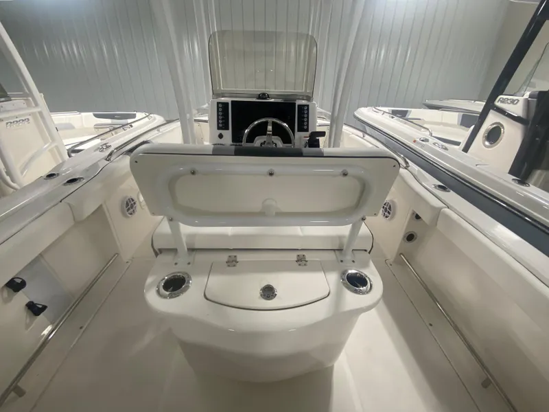 Slide: The Image of 2024 Robalo R222 boat interior with helm and seating. - 5