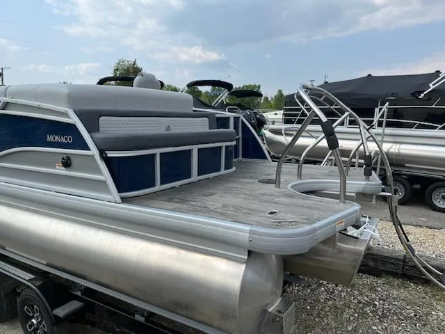 Slide: The Image of 2023 Godfrey Monaco 235C Back Porch pontoon boat on a trailer. - 2