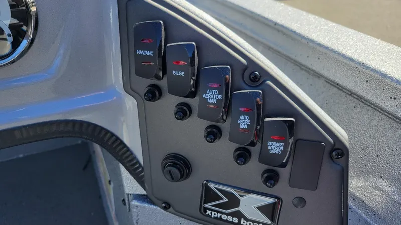 Slide: The Image of Control panel of 2025 Xpress H17C boat with various switches and labels. - 18