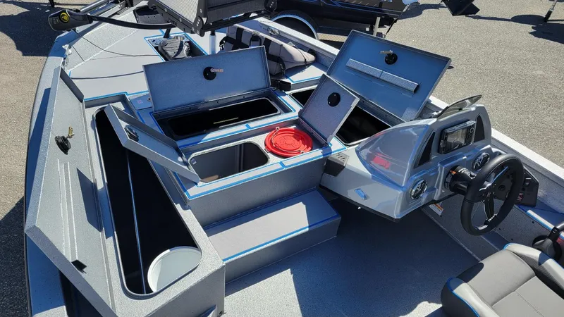 Slide: The Image of 2025 Xpress H17C Crappie boat interior with storage compartments and Yamaha Vmax 90 controls. - 5