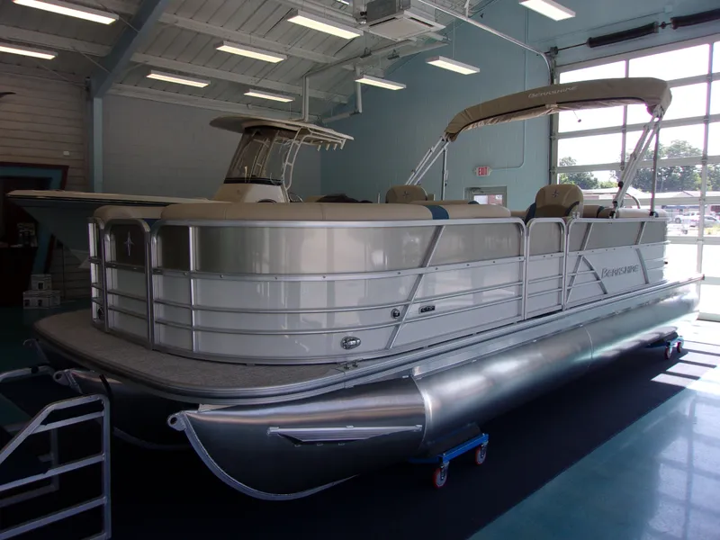 The Image of 2023 Berkshire CTS Series 24RFX pontoon boat in a showroom. - 1