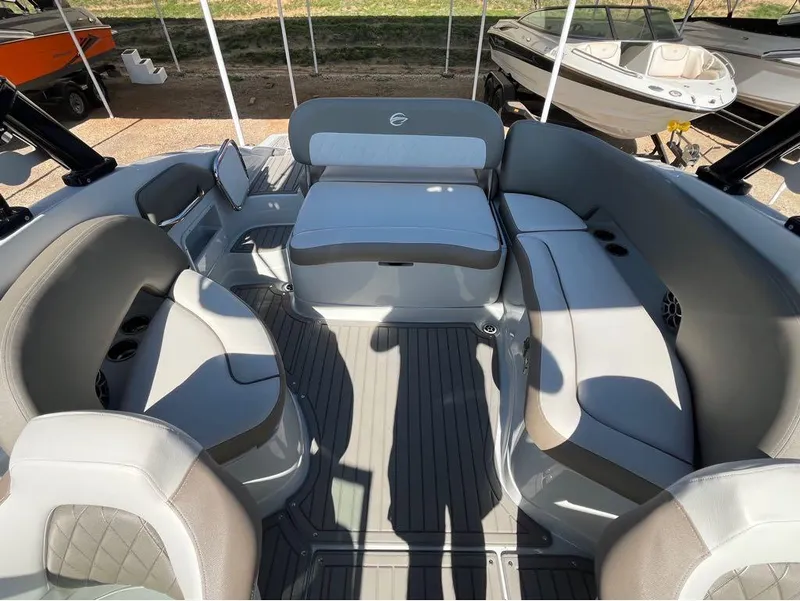 Slide: The Image of 2023 Crownline E255 Surf boat interior with spacious seating and modern design. - 4