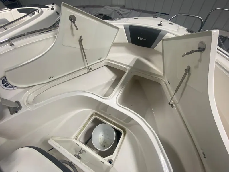 Slide: The Image of 2024 Robalo R222 boat storage compartments and seating area. - 16