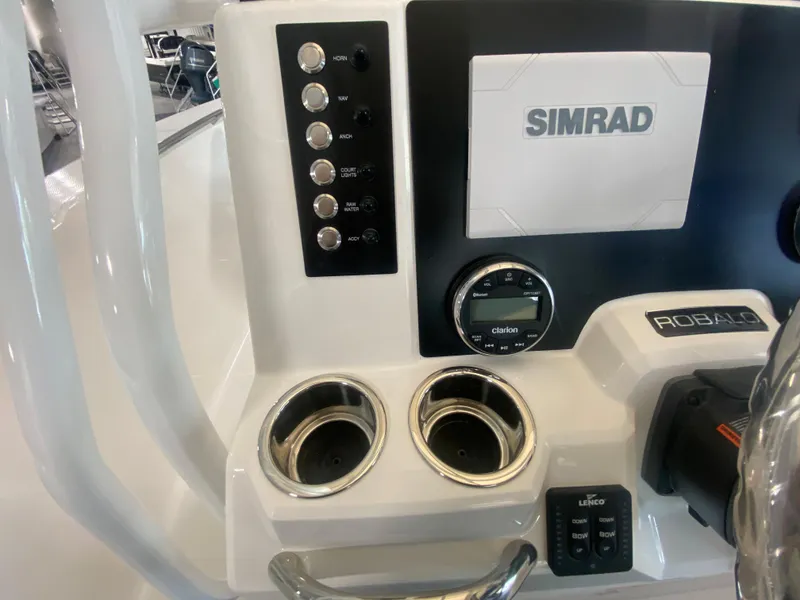 Slide: The Image of 2024 Robalo 202 EXPLORER boat dashboard with Simrad display and cup holders. - 15