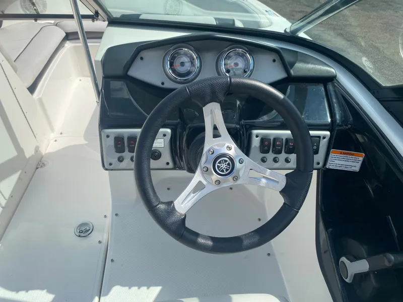 Slide: The Image of 2014 Yamaha Boats AR192 dashboard and steering wheel. - 14