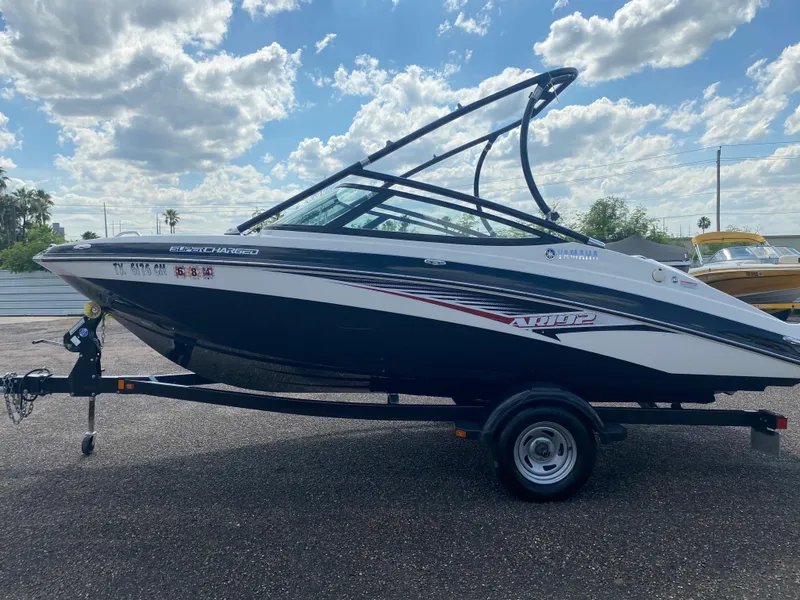 Slide: The Image of 2014 Yamaha Boats AR192 on trailer under cloudy sky. - 8
