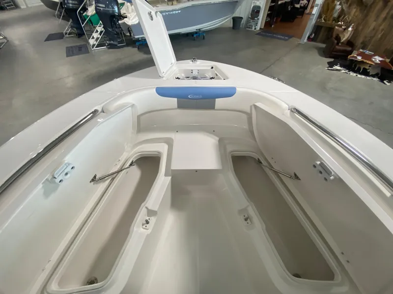 Slide: The Image of 2024 Robalo 202 EXPLORER boat interior with open storage compartments. - 10