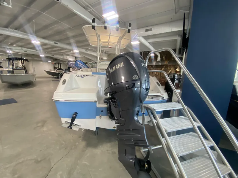 Slide: The Image of 2024 Robalo 202 EXPLORER boat with Yamaha outboard motor in showroom. - 3