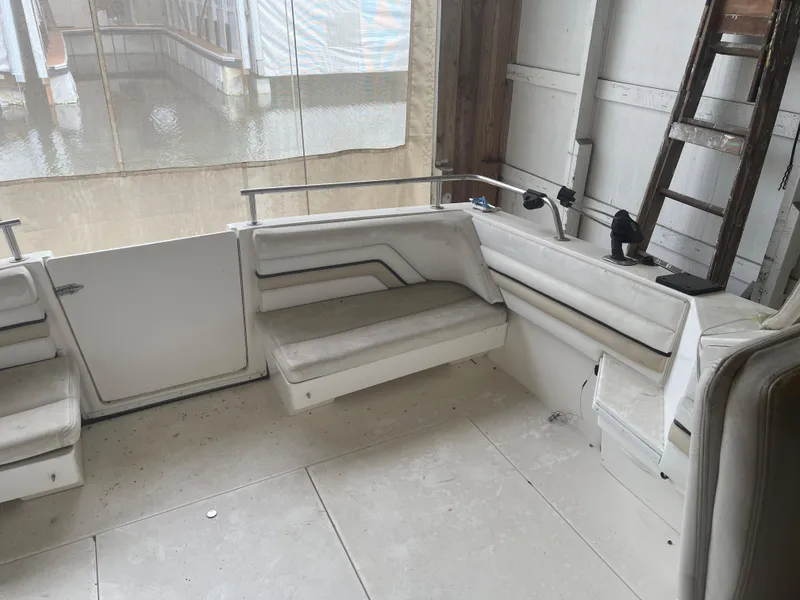 Slide: The Image of 1993 Wellcraft St Tropez 3200 boat interior with white seating and control panel. - 12