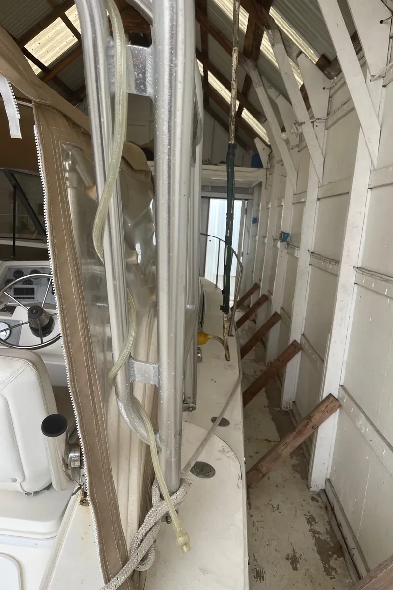 Slide: The Image of 1993 Wellcraft St Tropez 3200 boat stored in a boathouse. - 14