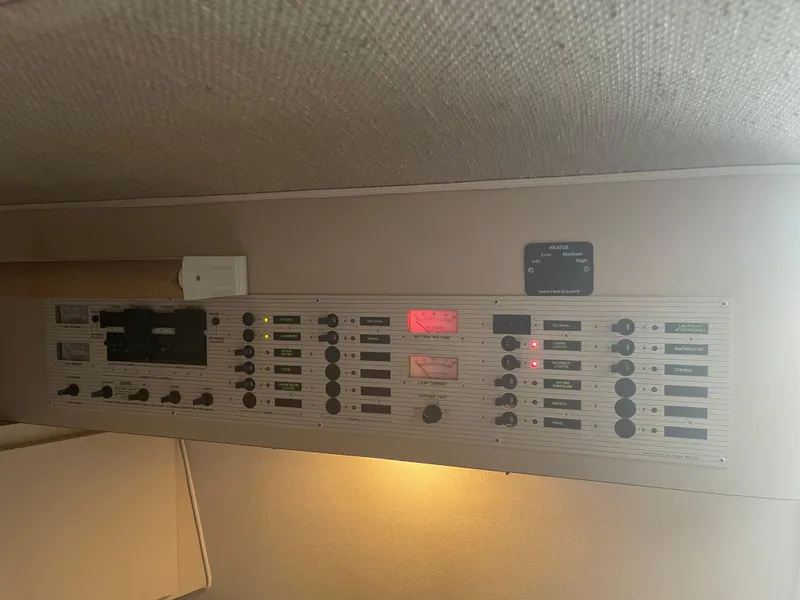 Slide: The Image of Electrical control panel of a 1993 Wellcraft St Tropez 3200 boat. - 27