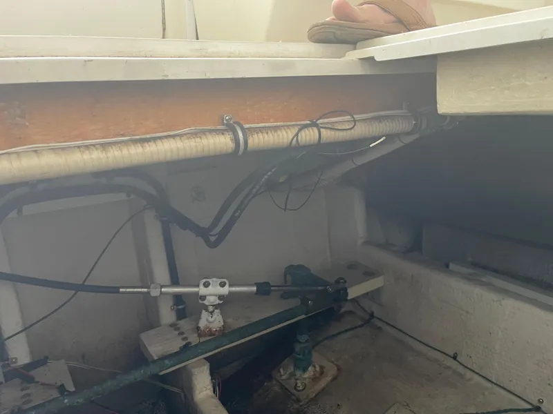 Slide: The Image of 1993 Wellcraft St Tropez 3200 boat interior showing mechanical components and wiring. - 33