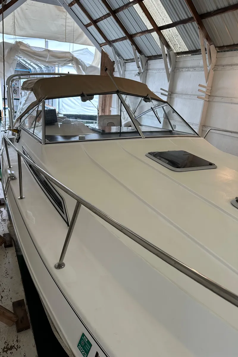 Slide: The Image of 1993 Wellcraft St Tropez 3200 boat in storage shed. - 38