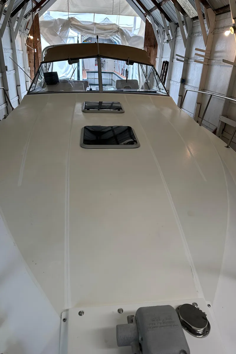 Slide: The Image of 1993 Wellcraft St Tropez 3200 boat in storage, front deck view. - 5
