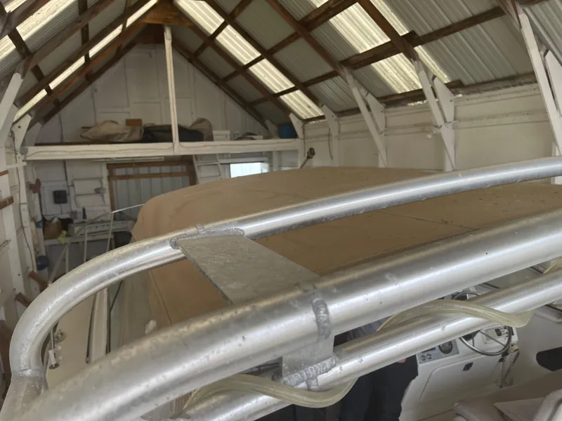 Slide: The Image of 1993 Wellcraft St Tropez 3200 boat stored in a wooden shed. - 9