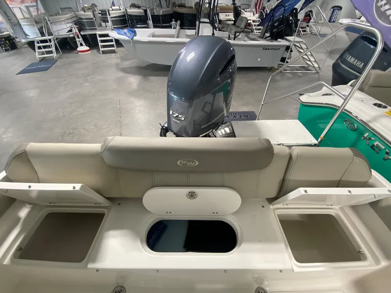 Slide: The Image of 2024 Key West 219 FS boat with Yamaha 175 engine in showroom. - 12