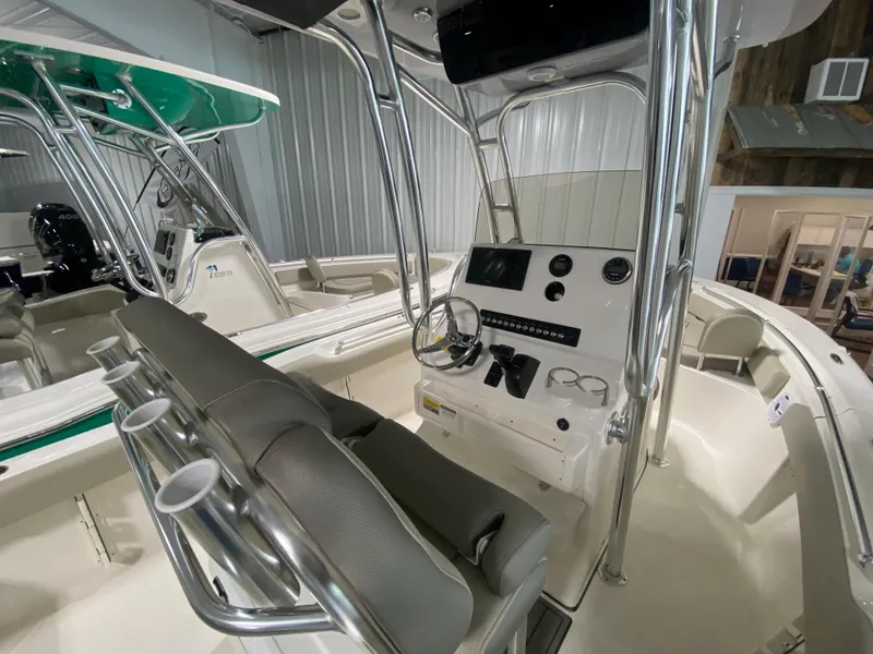 Slide: The Image of 2024 Key West 219 FS boat interior with helm station and seating. - 5