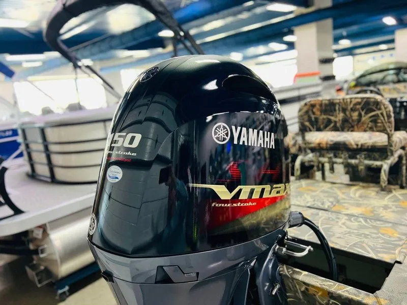 Slide: The Image of Yamaha VMAX outboard motor on 2025 War Eagle Blackhawk 2170 boat, indoor showroom. - 10