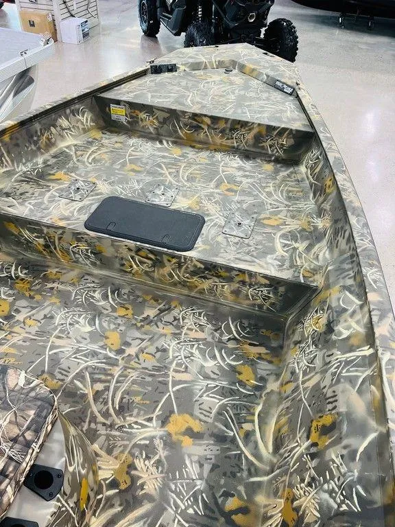 Slide: The Image of 2025 War Eagle Blackhawk 2170 boat with camouflage interior design. - 3