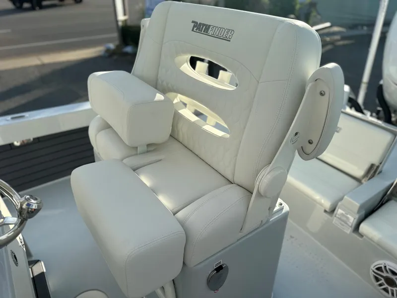 Slide: The Image of Pathfinder 2600 TRS 2025 model boat seat with armrests and logo. - 11