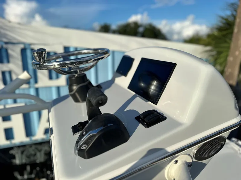 Slide: The Image of 2025 Pathfinder 2600 TRS boat console with steering wheel and control panel. - 13