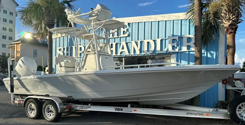 Slide: The Image of 2025 Pathfinder 2600 TRS boat on trailer outside The Ship Chandler. - 17