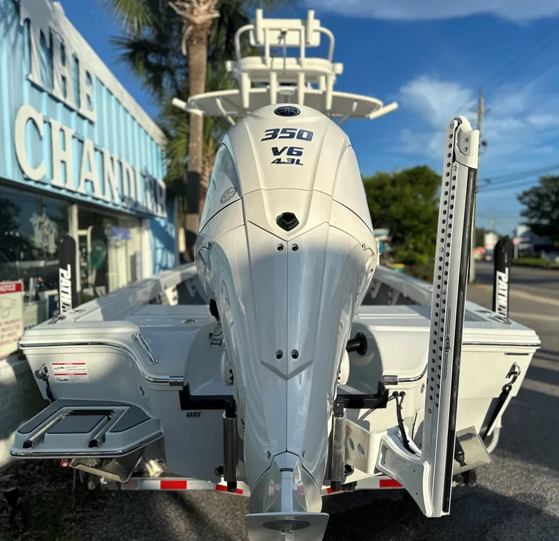 Slide: The Image of 2025 Pathfinder 2600 TRS boat with 350 V6 engine at a dealership. - 3