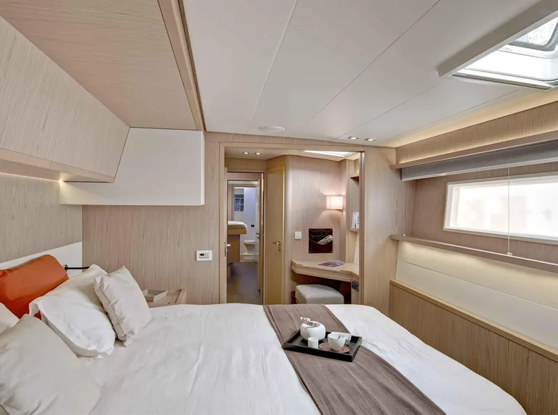Slide: The Image of Luxurious cabin interior of 2020 Lagoon 52 F yacht with modern furnishings and natural light. - 7