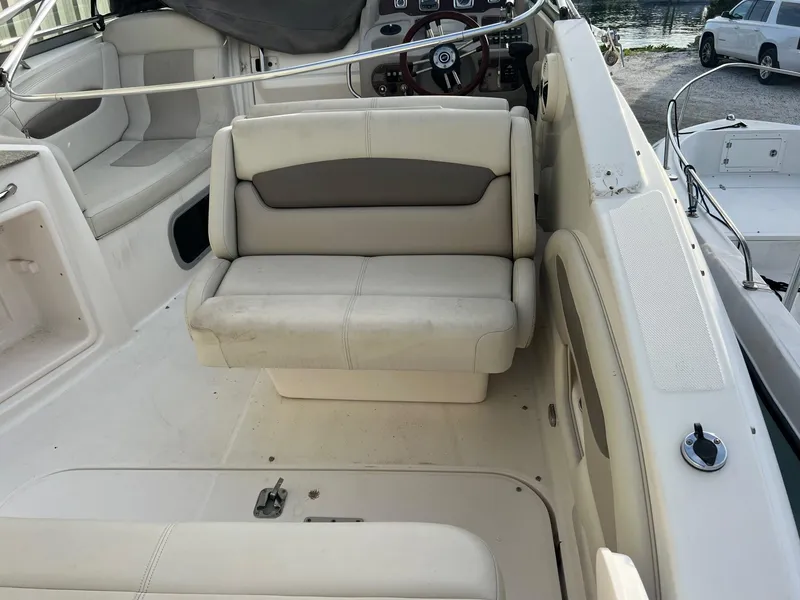 Slide: The Image of 2008 Chaparral Signature 250 boat interior with beige seating and steering wheel. - 3