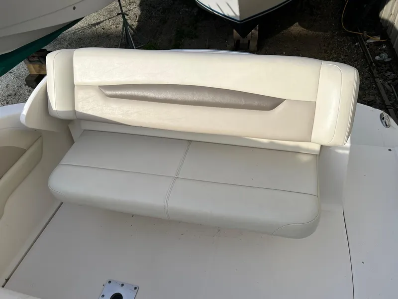 Slide: The Image of 2008 Chaparral Signature 250 boat seat, white upholstery, outdoor setting. - 4