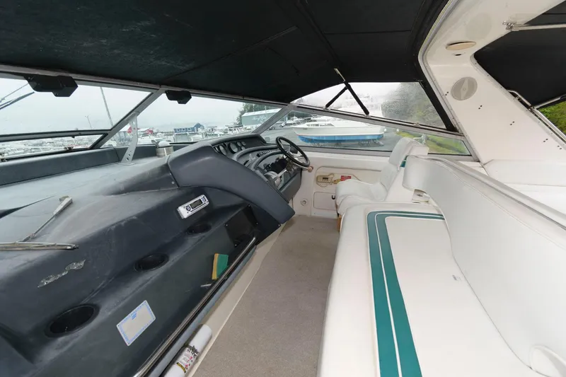 Slide: The Image of Interior view of 1993 Sea Ray 500 Sundancer yacht with helm and seating area. - 4