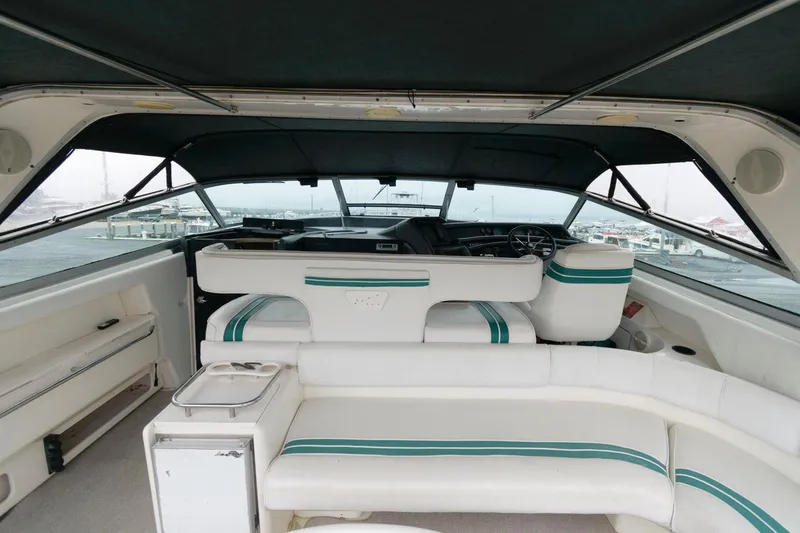 Slide: The Image of Interior of 1993 Sea Ray 500 Sundancer yacht with white and teal seating. - 7