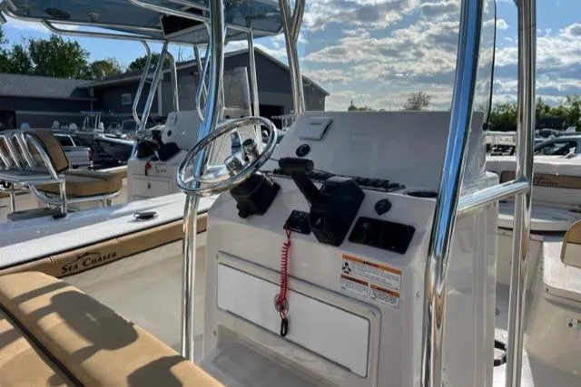 Slide: The Image of 2023 Sea Chaser 22 HFC boat interior with steering console and seating. - 5