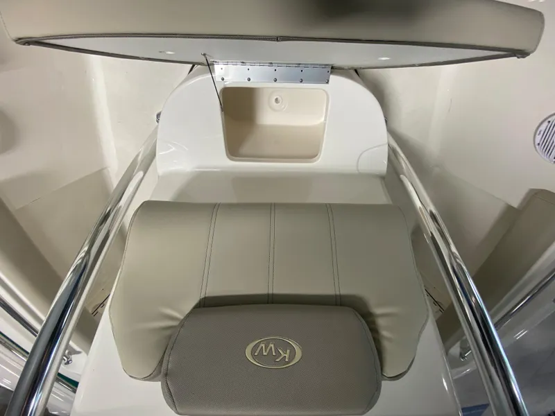 Slide: The Image of 2024 Key West 219 FS boat seat and storage compartment. - 14