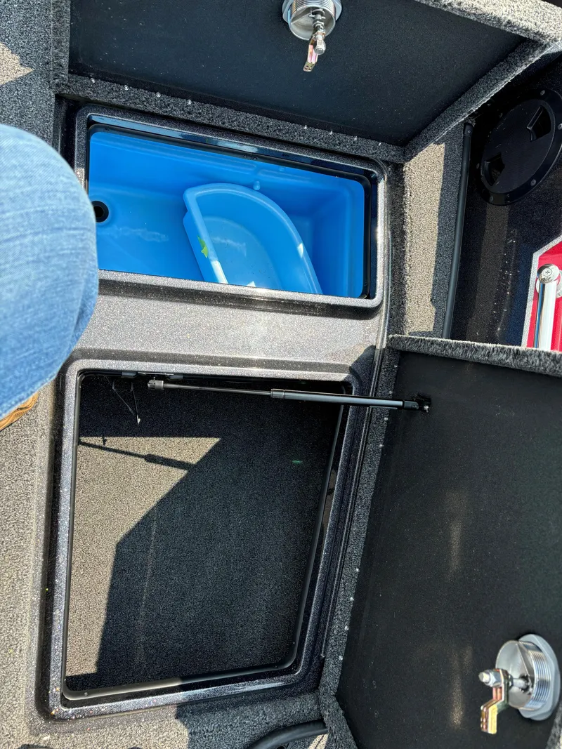 Slide: The Image of 2023 Nitro ZV20 Pro boat storage compartments with blue container. - 13