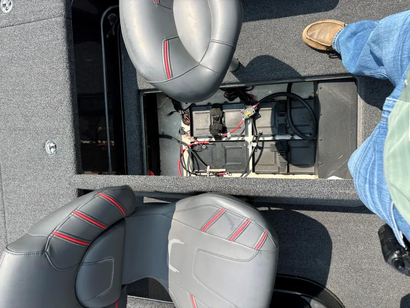 Slide: The Image of 2023 Nitro ZV20 Pro boat interior with open battery compartment and two seats. - 14