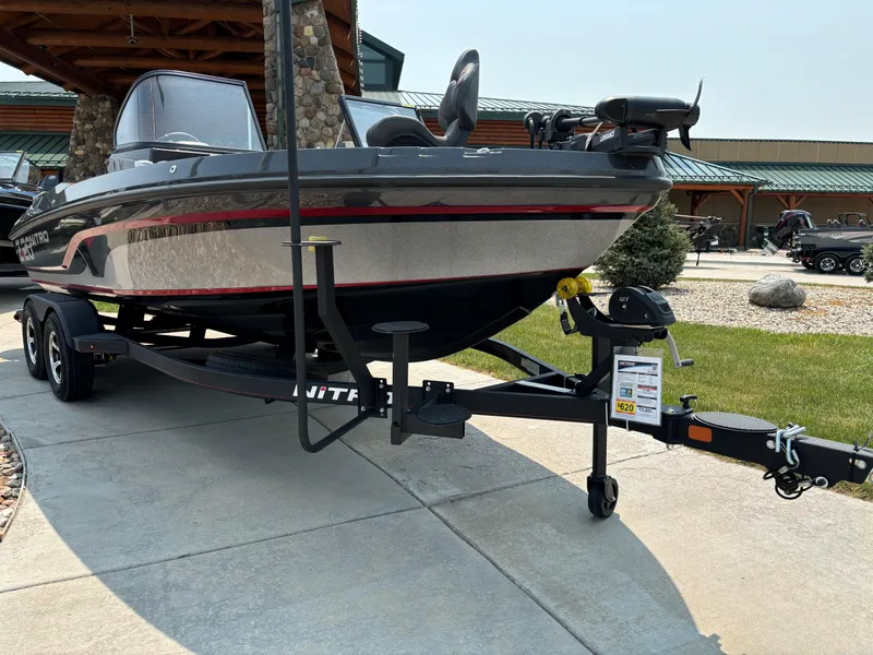 Slide: The Image of 2023 Nitro ZV20 Pro boat on trailer, parked on concrete driveway. - 2