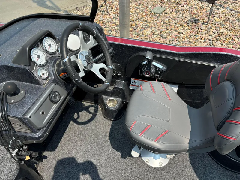 Slide: The Image of 2023 Nitro ZV20 Pro boat cockpit with steering wheel and control panel. - 9