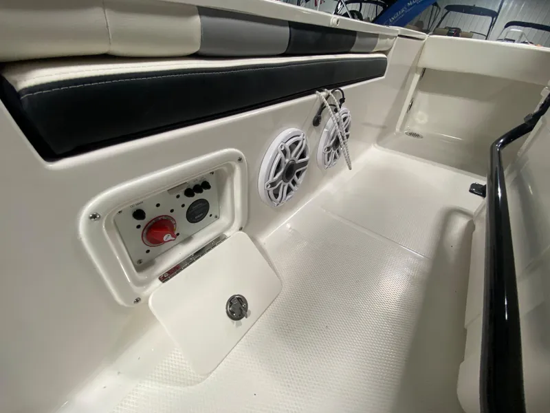 Slide: The Image of 2024 Robalo 246 Cayman boat interior with speakers and control panel. - 18