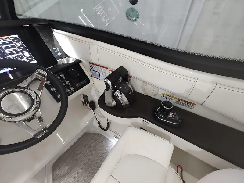 Slide: The Image of Cockpit of 2020 Sea Ray Sundancer 320 with modern controls. - 14