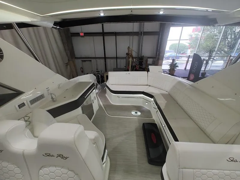 Slide: The Image of Interior of a 2020 Sea Ray Sundancer 320 yacht, luxurious white seating. - 5