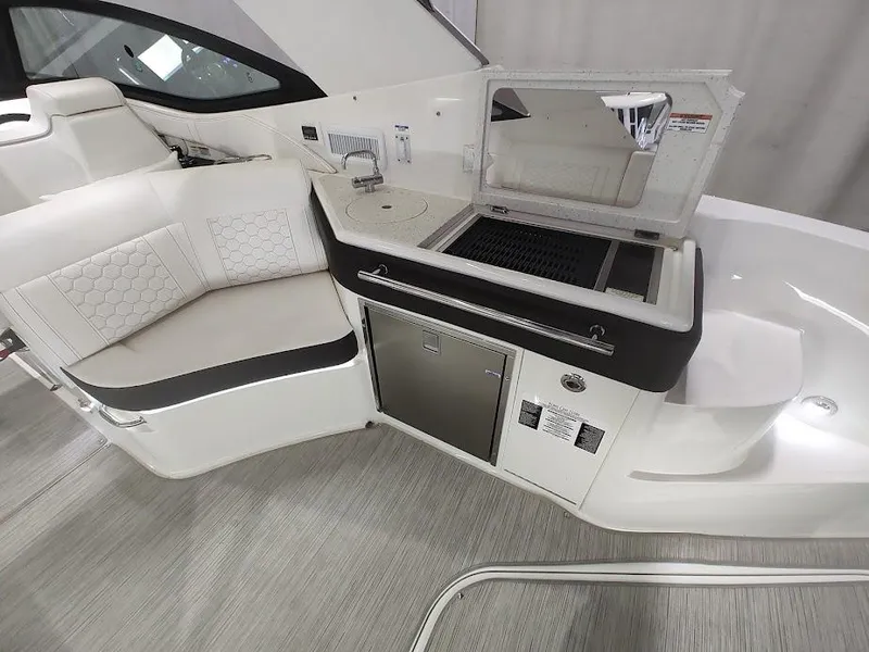 Slide: The Image of Interior of 2020 Sea Ray Sundancer 320 yacht with seating and kitchenette. - 7